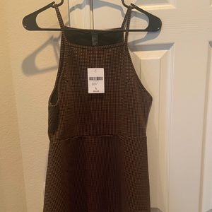 Black and orange spotted mini dress